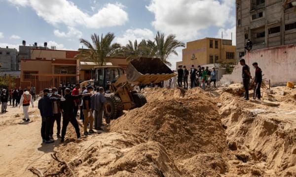The Palestinian Civil Defense recovers 50 bodies from what they are calling a mass grave inside Nasser hospital in Khan Younis, Gaza, on 21 April 2024. Photograph: Haitham Imad/EPA