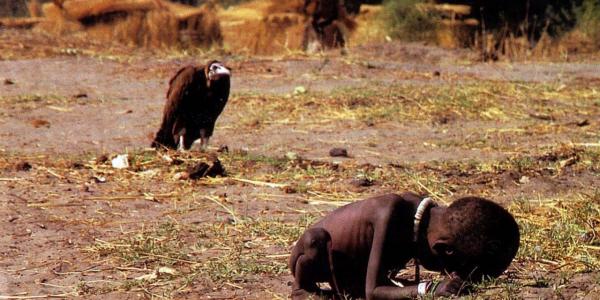 The prize-winning image: A vulture watches a starving child in southern Sudan, March 1, 1993.