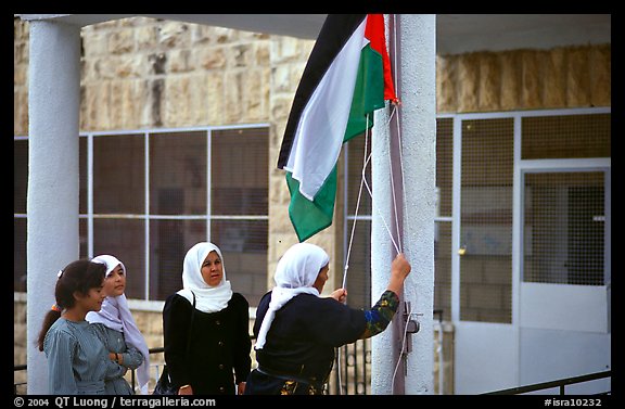 Women raise the Palestinian flag at a school in East Jerusalem.