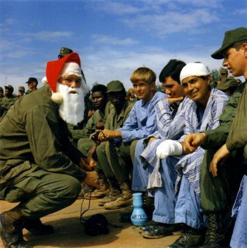 Vietnam…"Santa Claus" talks with a group of hospital patients during the Bob Hope Christmas Show. 22-29 Dec 1970