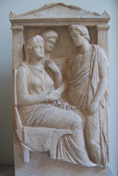 Lysistrata and other Athenian women. Marble steele, 325-350 bC. The inscription reads Λυσιστράτη Παναθηναῖς, "Lysistrata [talking] to all Athenian women".