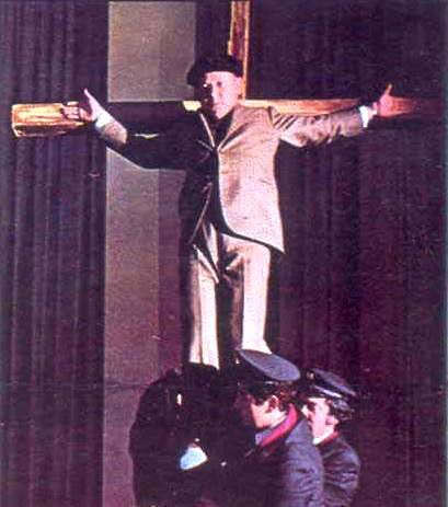 "Crucified in the corporate canteen". Paolo Villaggio, Fantozzi, 1975.
